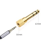 Adaptador de audio salida macho 1/4" (6.35mm)  y entrada hembra de 3.5mm mono/stereo